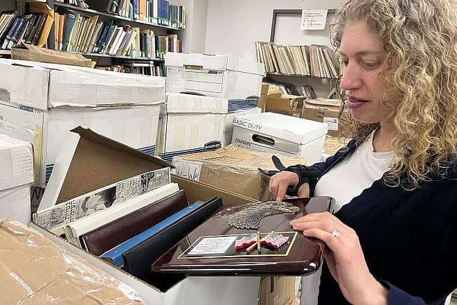 Gratz College's director of digital scholarship Alison Joseph goes through some of the many boxes that contain Elie Wiesel's archives. Credit: Courtesy of Gratz College.
