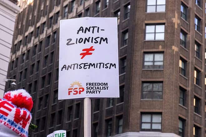 Pro-Palestinan protesters gather in Herald Square in New York City for a “March for the Martyrs” rally, showing a sign: “Anti-Zionism Does Not Equal Antisemitism,” Dec. 16, 2023. Credit: Syndi Pilar/Shutterstock.