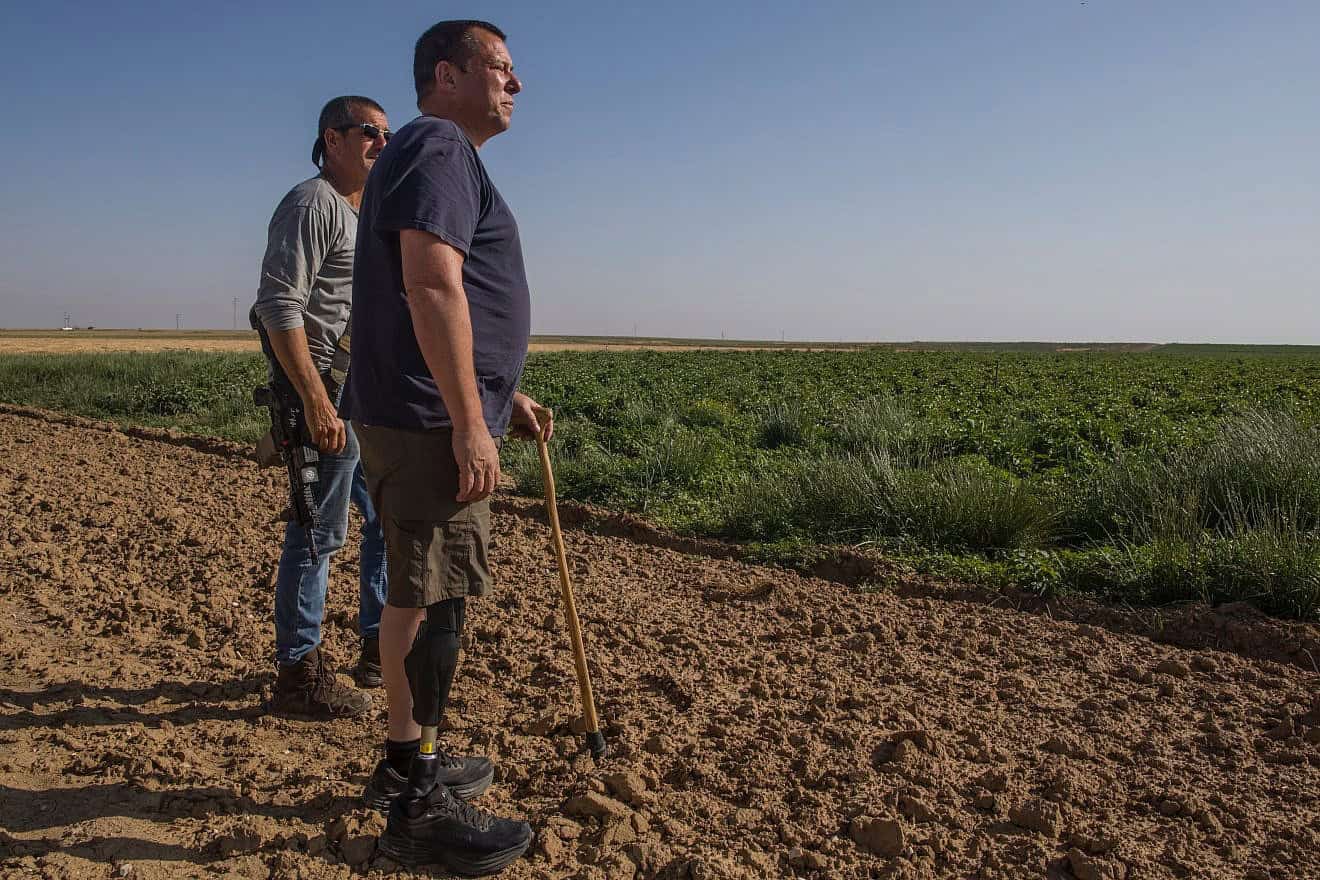 Avida Bachar surveys the fields at Kibbutz Be'eri, April 15, 2024. Photo by Rina Castelnuovo.