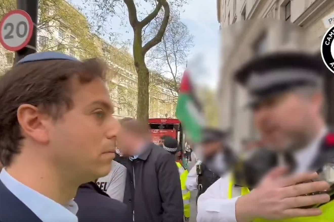 A Metropolitan Police Officer tells Gideon Falter of the Campaign Against Antisemitism that if he remains near the protest he will be arrested. Source: X.