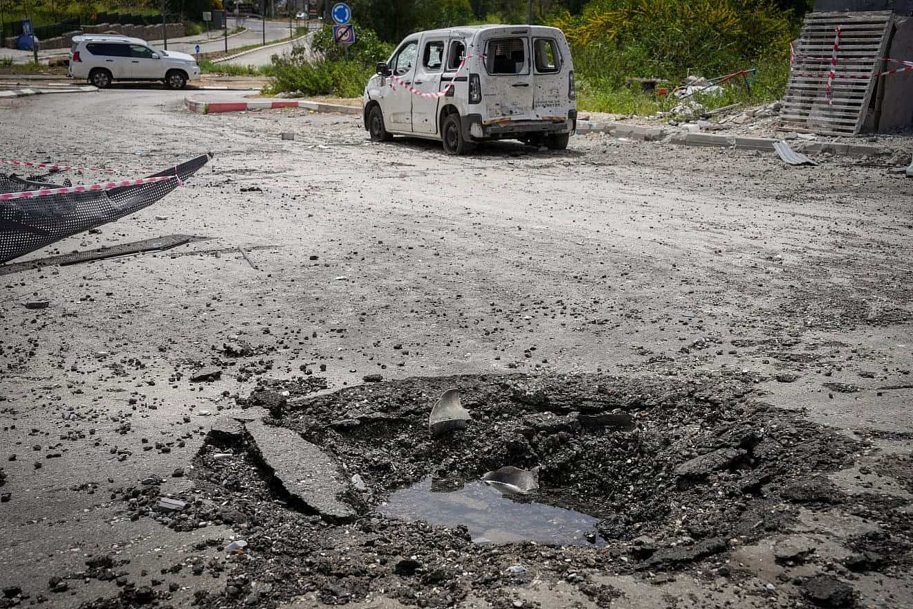 Damage in Kiryat Shmona after a Hezbollah rocket hit a parking area, March 27, 2024. Photo by Ayal Margolin/Flash90.