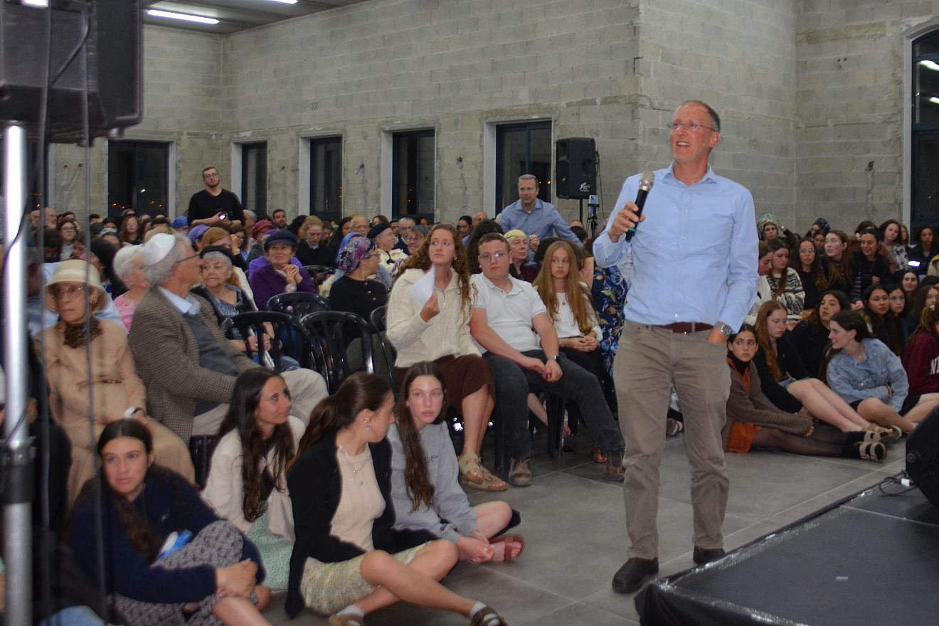 Rabbi Leo Dee speaks at the Shirat Lucy events hall in Efrat at an event to commemorate the lives of his wife, Lucy, and daughters Miai and Rina, who were killed in a terrorist attack on April 7, 2023. Credit: Courtesy.