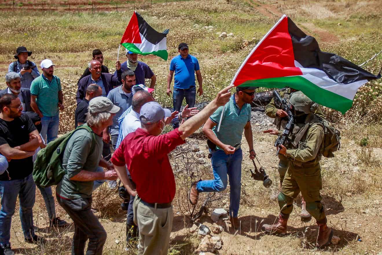Palestinians and left-wing activists clash with Israeli security forces in the village of Beit Dajan in Samaria, May 12, 2023. Photo by Nasser Ishtayeh/Flash90.