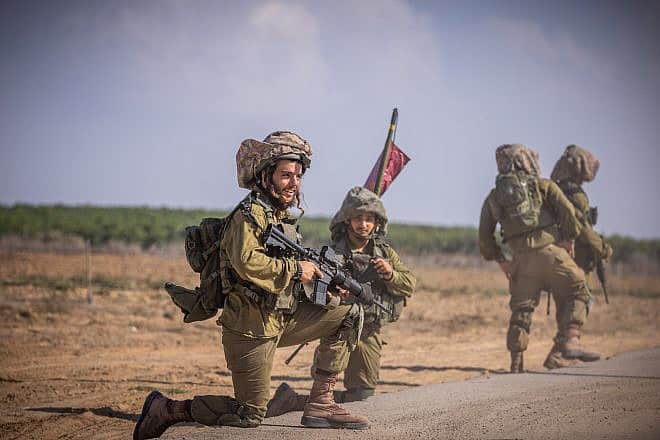 Israel Defense Forces soldiers of the Netzach Yehuda Battalion patrol near the Gaza border, Oct. 20, 2023. Photo by Yonatan Sindel/Flash90.