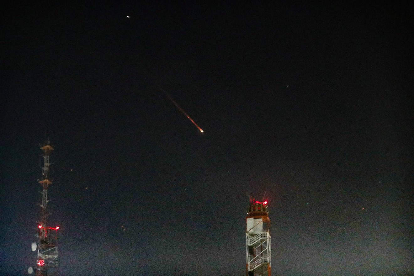 An Israeli missile-defense system downs Iranian projectiles over Jerusalem, April 14, 2024. Photo by Jamal Awad/Flash90.