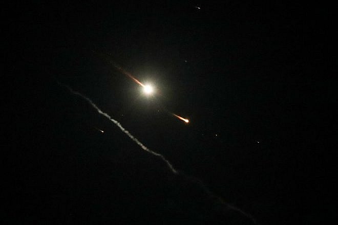 An Israeli anti-missile system fires interceptors at drones, rockets and missiles launched by Iran, as seen over the city of Hebron on April 14, 2024. Photo by Wisam Hashlamoun/Flash90.