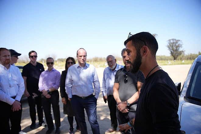 Nova music festival survivor Asaf Aharon shares his story at Nova with mission participants. Credit: Courtesy of the Orthodox Union.