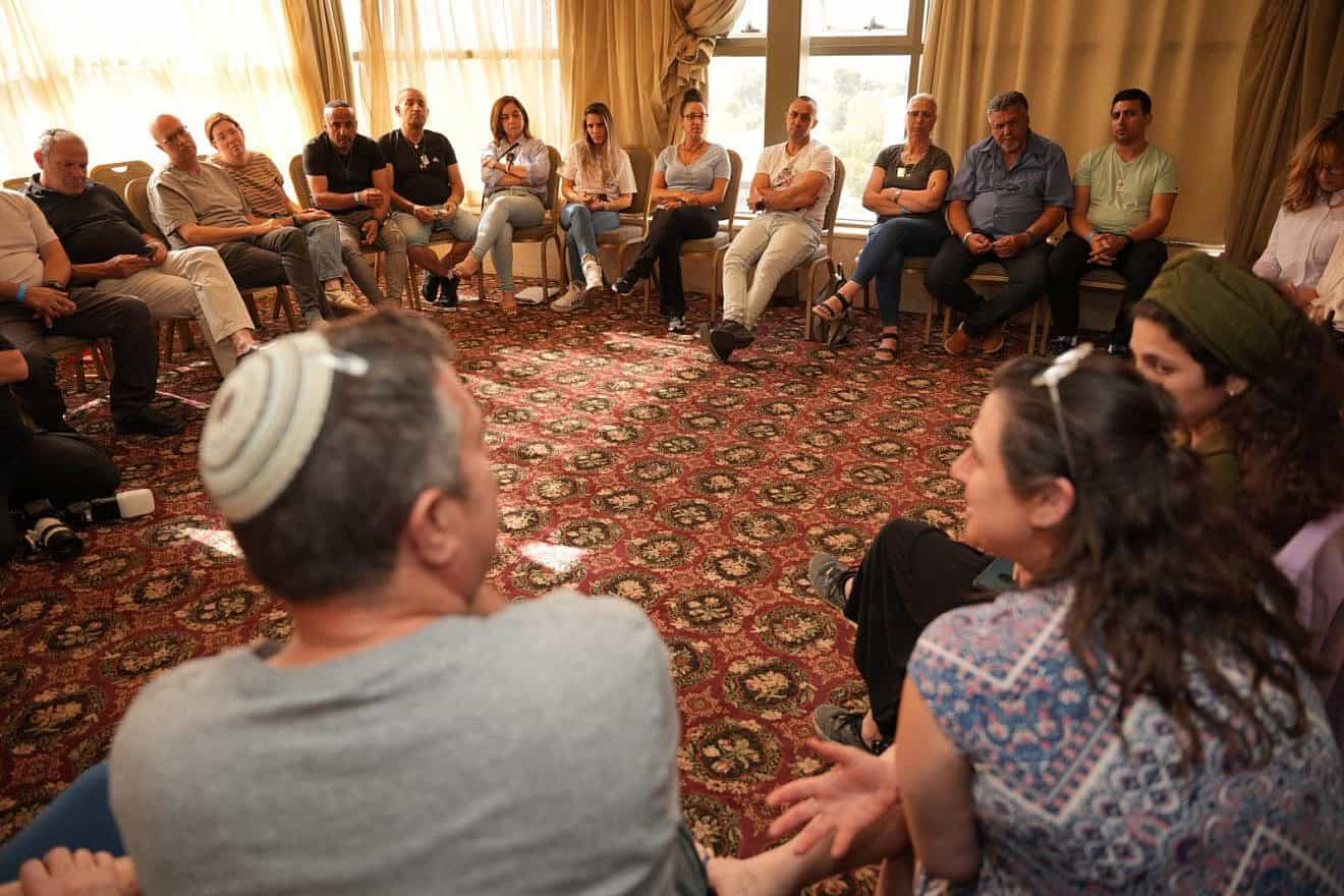 Group therapy helps bereaved families cope and build a supportive community based on shared experiences. Photo by Meir Pavlovsky/OneFamily.