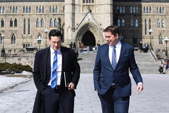 Canadian Parliament member Pierre Poilievre of the Conservative Party with colleague MP Andrew Scheer on Parliament Hill in downtown Ottawa, Ontario, on Feb. 28, 2018. Credit: Flickr via Wikimedia Commons.