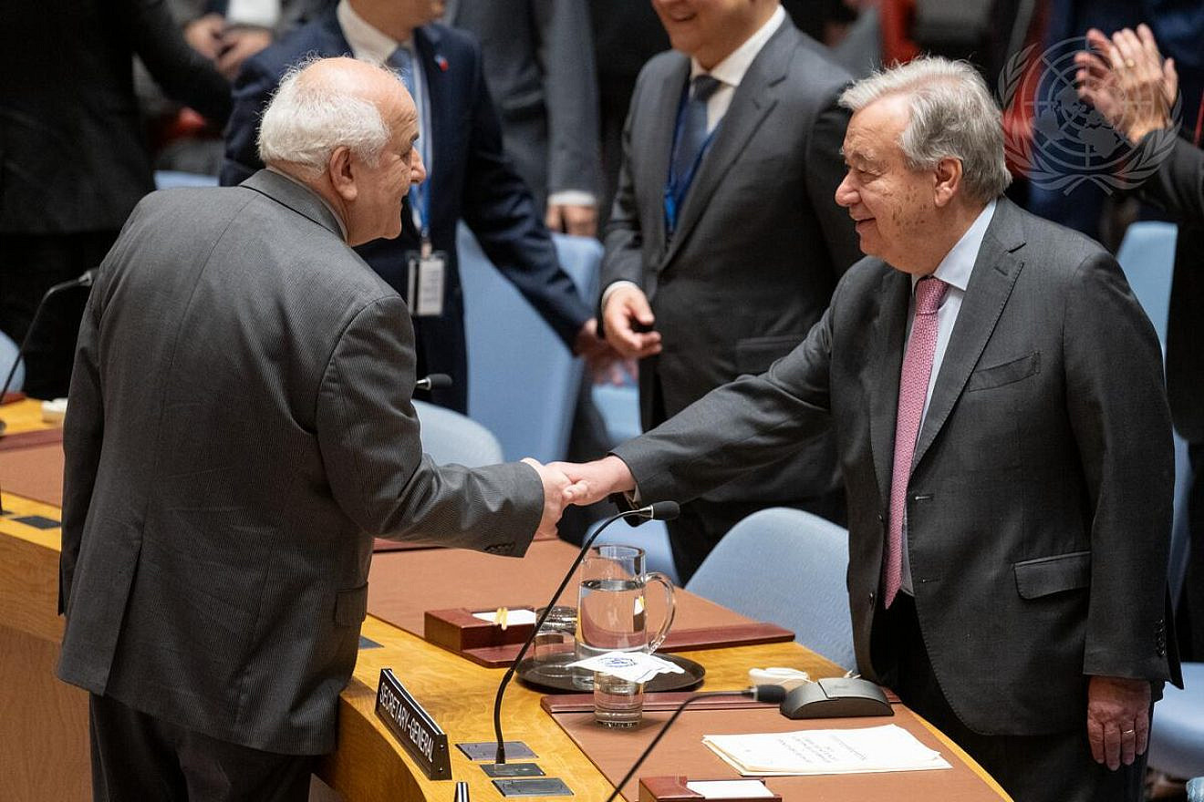 Riyad Mansour (left), permanent observer of the "State of Palestine" to the U.N, greets Secretary-General António Guterres ahead of a Security Council meeting on the situation in the Middle East, including the Palestinian question, April 18, 2024. Credit: Manuel Elías/U.N. Photo.