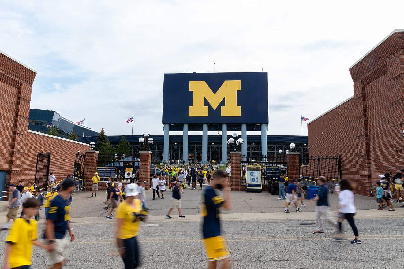 Sports fans exit Michigan Stadium after a University of Michigan football game on Sept. 4, 2021. Credit: Chad Robertson Media/Shutterstock.