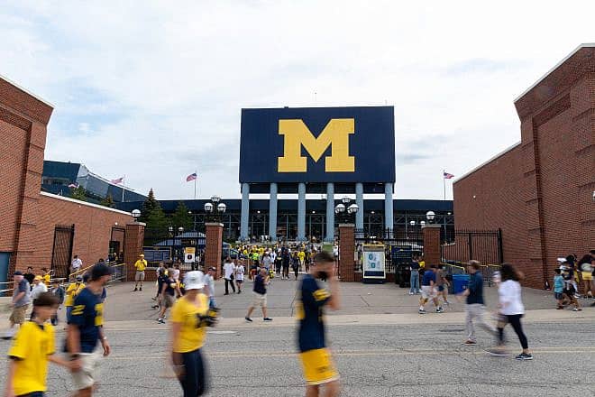 Sports fans exit Michigan Stadium after a University of Michigan football game on Sept. 4, 2021. Credit: Chad Robertson Media/Shutterstock.