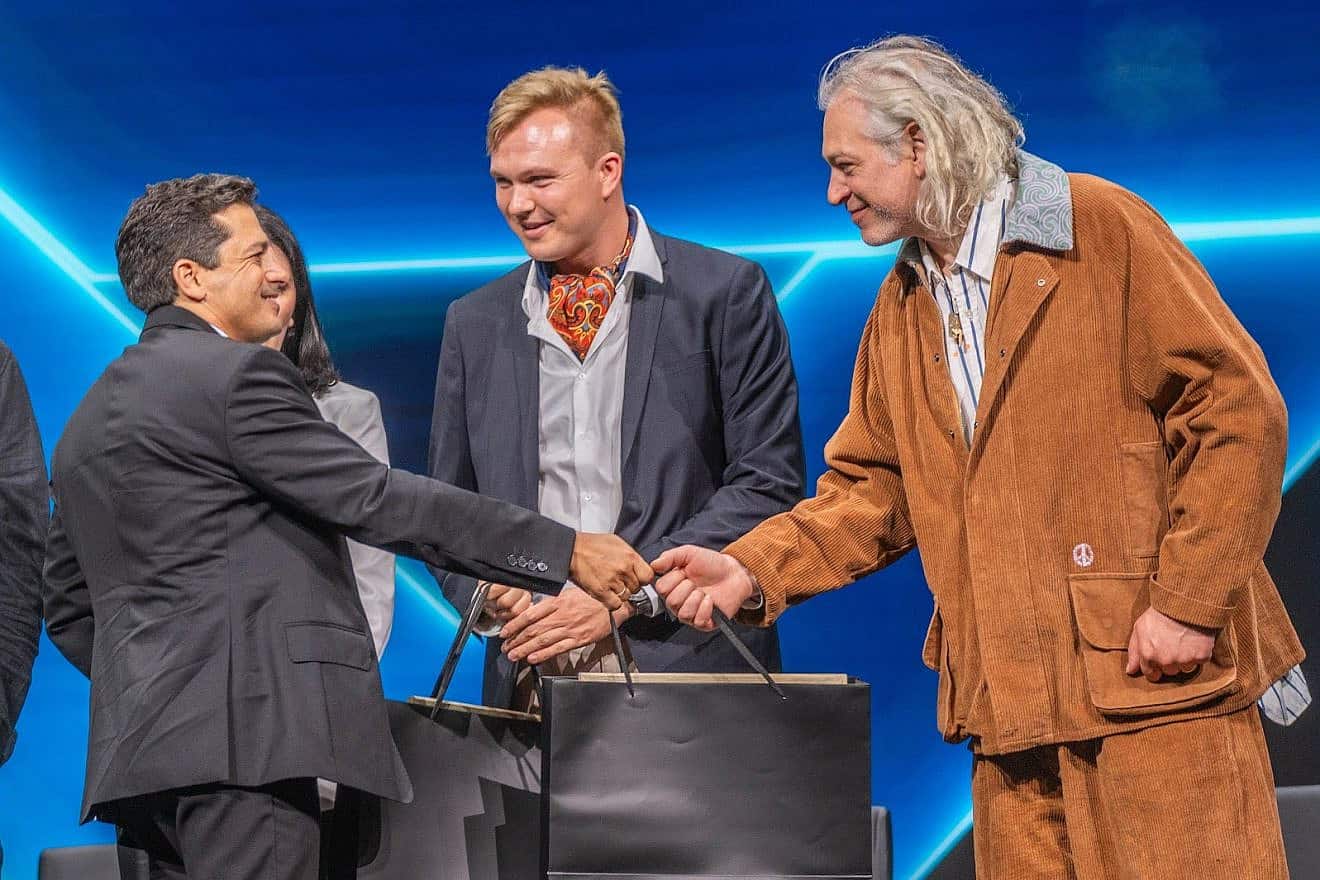 Social-media influencer Stefan Tompson (center; at right is the singer Matisyahu) is honored by Israeli Minister of Diaspora Affairs Amichai Chikli in Jerusalem on March 31, 2024. Credit: Courtesy.