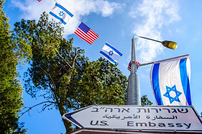 New street sign for U.S. embassy in Jerusalem, with American and Israeli flags. Credit: John Theodor/Shutterstock.