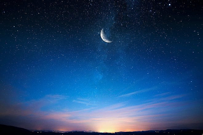 An image of the crescent moon in the night sky. Source: Efasein/Shutterstock