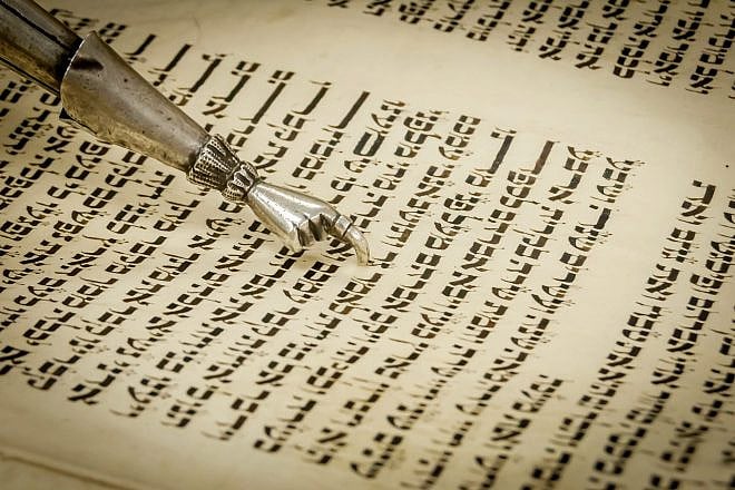 Torah pointer (yad) marking the place early on in Chayei Sarah, the fifth parsha in the book of Genesis. Credit: Roman Yanushevsky/Shutterstock.