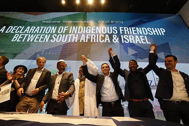 Members of the South Africa-based Nazareth Baptist Church sign a declaration of friendship with Israel at the Friends of Zion Museum in Jerusalem, May 12, 2024. Credit: Yossi Zamir.