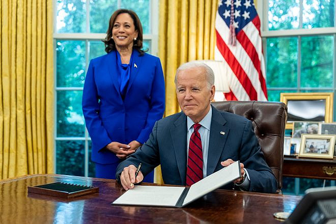 U.S. President Joe Biden, joined by Vice President Kamala Harris, signs an executive order in the Oval Office to Strengthen Access to Affordable, High-Quality Contraception and Family Planning Services on June 23, 2023. Photo by Adam Schultz/White House.