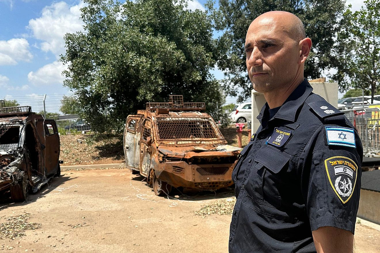 Shlomi Chetrit, superintendent and head of research at the Israel Police, at a display at an Israeli police academy of charred armored vehicles that were destroyed on Oct. 7, on May 12, 2024. Credit: Courtesy.