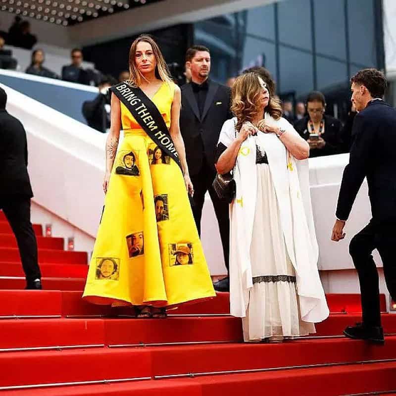 Laura Blajman-Kadar wears a yellow dress highlighting the plight of hostages held by Hamas in Gaza and a black scarf calling for their release at the Cannes Film Festival. Photo courtesy of Laura Blajman-Kadar.