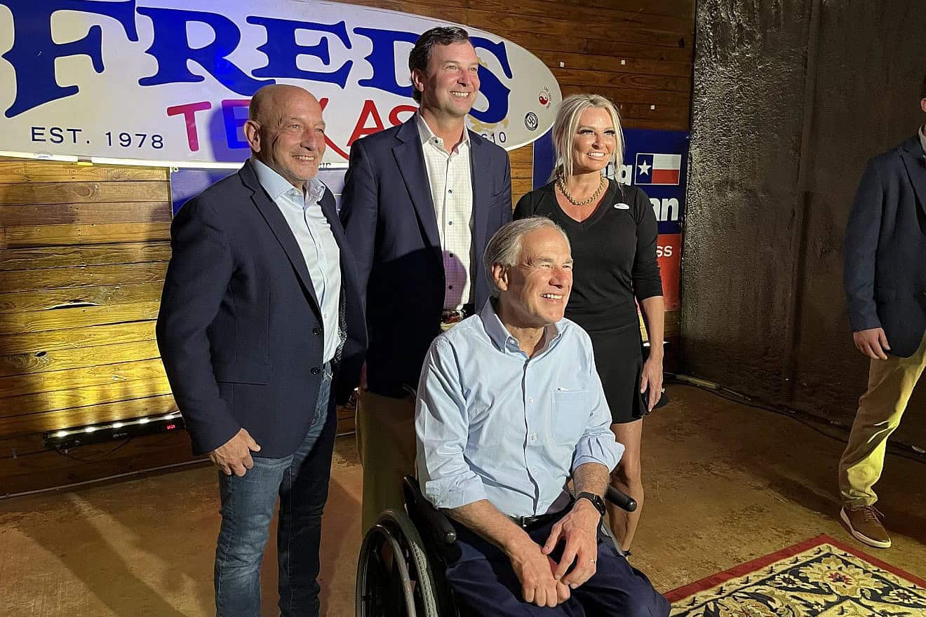 Texas Gov. Greg Abbott (seated) with congressional candidate Craig Goldman (rear, center) in Fort Worth, May 21, 2024. Credit: Greg Abbott/X.