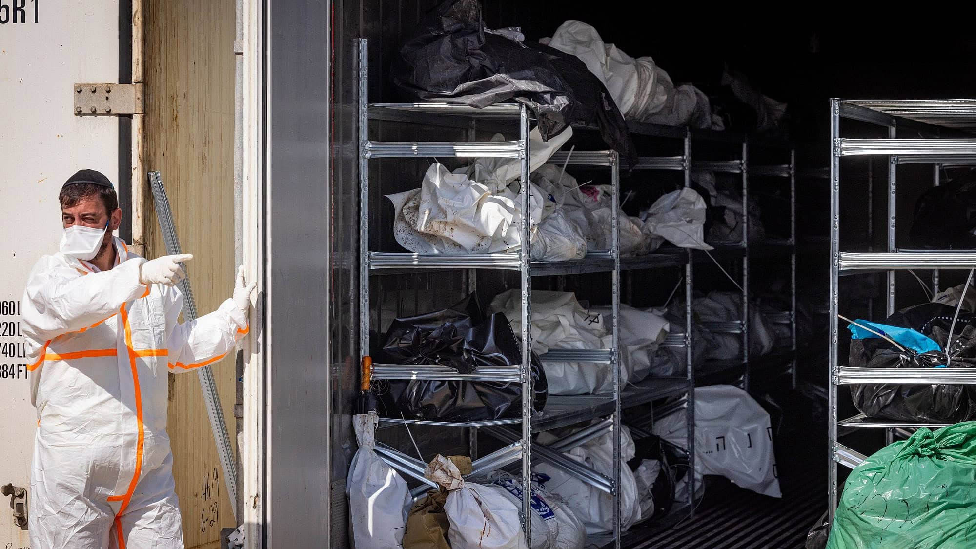 ZAKA personnel and Israeli soldiers at the forensic center in the Shura military base near Ramle, where hundreds of dead bodies arrived after Hamas's Oct. 7 massacre, Oct. 13, 2023. Photo by Nati Shohat/Flash90.