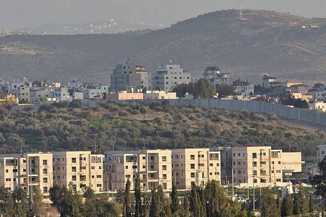 The Israeli town of Bat Hefer backdropped by the Palestinian city of Tulkarem, situated on the western edge of northern Samaria, Jan. 4, 2024. Photo by Shahar Yaari/Flash90.