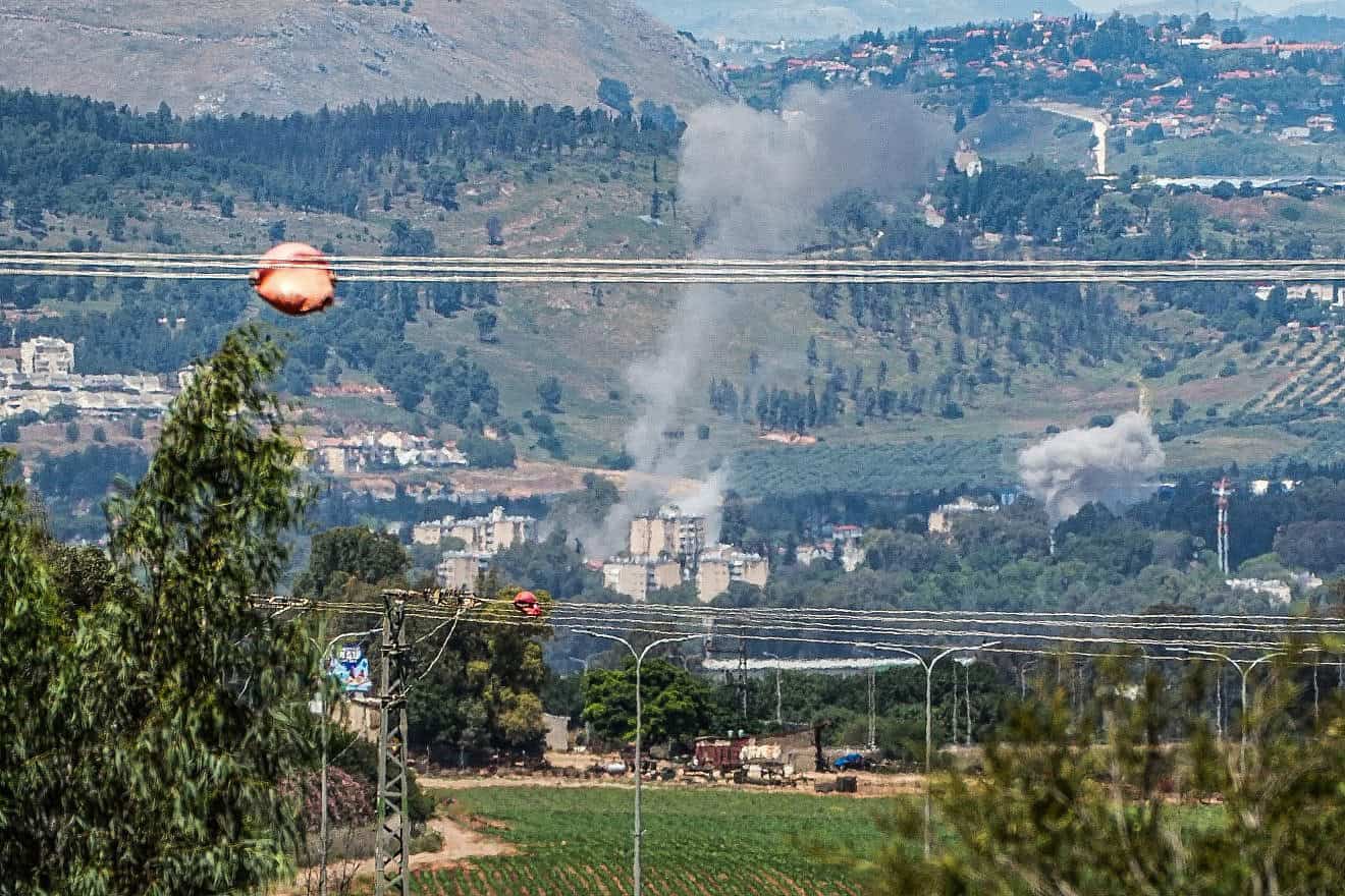 Smoke rises after rockets fired from Lebanon hit the northern Israeli city of Kiryat Shmona, May 5, 2024. Photo by Ayal Margolin/Flash90.