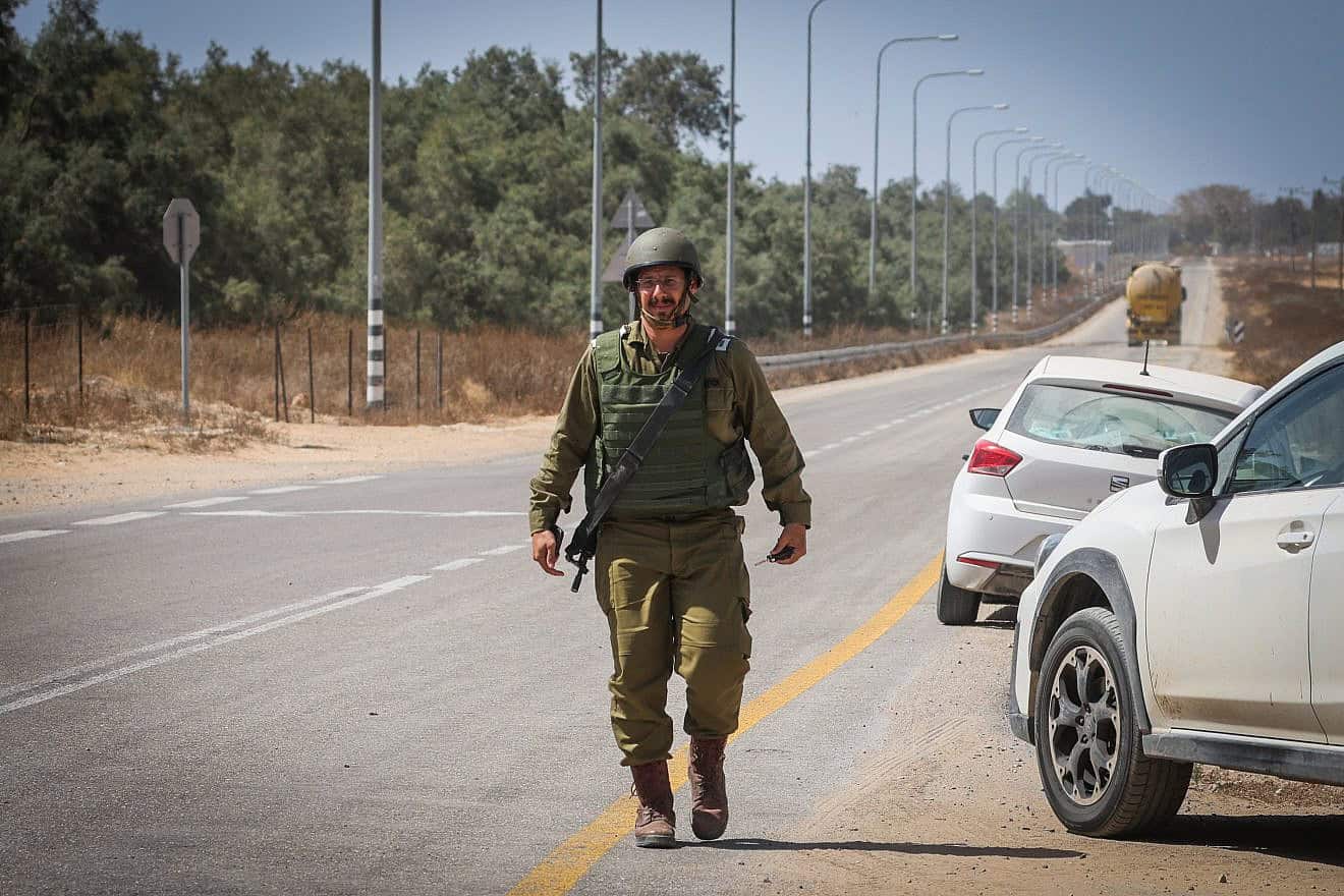 An IDF soldier near the Kerem Shalom Crossing to Gaza after mortar shells fired from the Strip hit the area, May 5, 2024. Credit: Flash90.