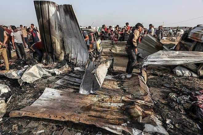 Palestinians inspect damage after an Israeli airstrike west of Rafah in the southern Gaza Strip, May 27, 2024. Photo by Abed Rahim Khatib/Flash90.