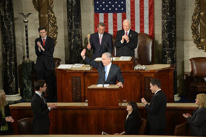 Israeli Prime Minister Benjamin Netanyahu waves to the crowd during his address to a joint session of Congress in Washington, March 3, 2015. Photo by Amos Ben Gershom/GPO.