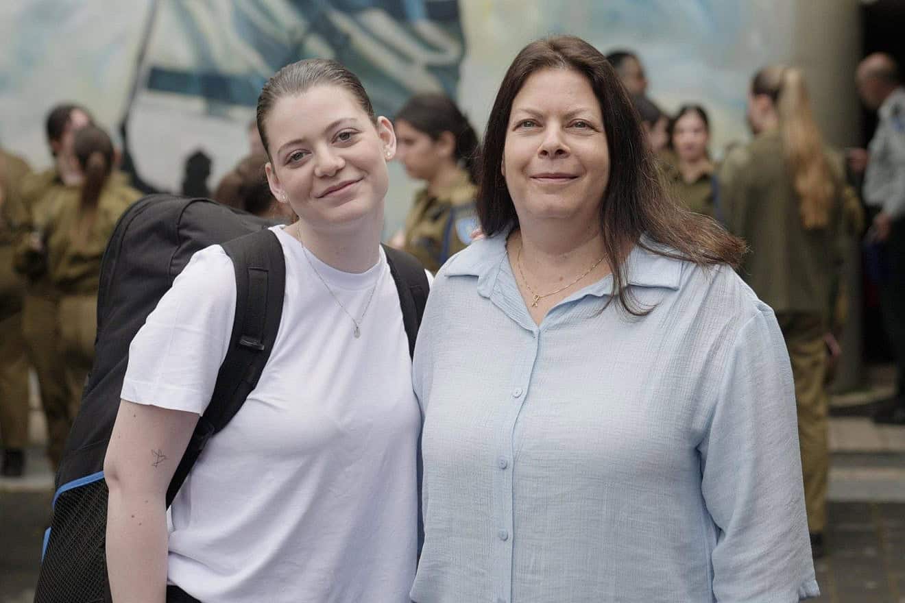 Former Gaza hostages Noga (left) and Shiri Weiss at an Israel Defense Forces recruitment center, May 6, 2024. Credit: IDF.
