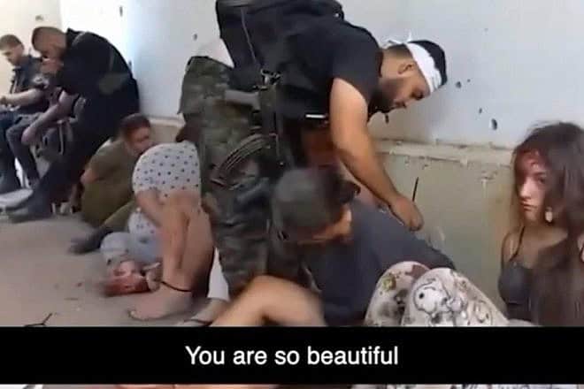 A screenshot from video of Hamas terrorists capturing female IDF field observers during the Oct. 7 massacre. Source: Hostages and Missing Families Forum/X.