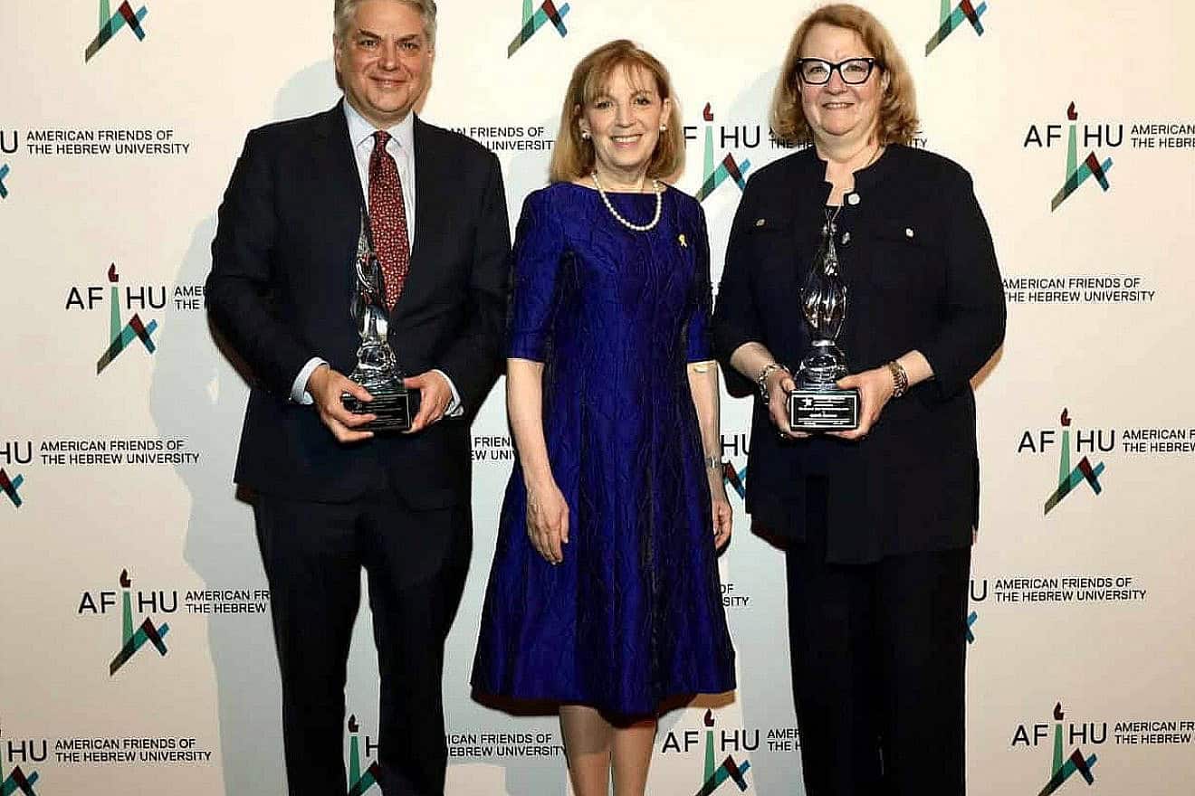 Milbank LLP Chairman Scott A. Edelman (left) receives the 54th Annual George A. Katz Torch of Learning Award (TOL) at Cipriani Midtown along with co-honoree, Prudential Financial General Counsel Ann M. Kappler (right). Presenting the award is American Friends of the Hebrew University President Pamela Emmerich. Credit: Courtesy of Hechler Photographers.