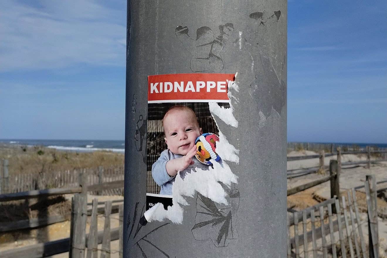 A half-ripped poster in Ventnor, N.J., of Kfir Bibas, an Israeli child abducted to Gaza with his 4-year-old brother and parents on Oct. 7 by Hamas terrorists who attacked southern Israel, April 28, 2024. Photo by Carin M. Smilk.