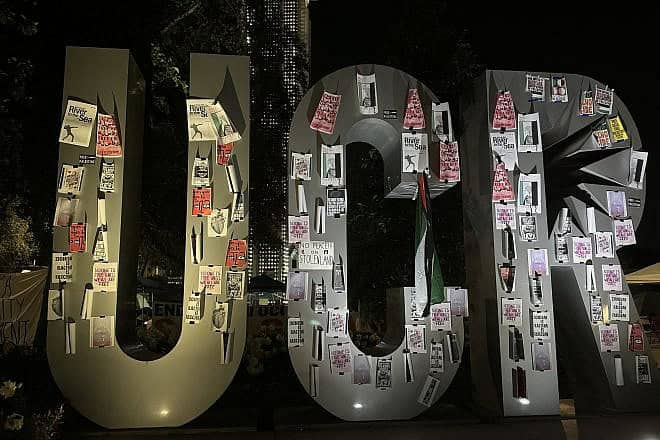 The UCR sign at the center of the University of California, Riverside, covered in pro-Palestine, anti-Israel and anti-Zionist symbols, April 30, 2024. Credit: Fluffy89502 via Wikimedia Commons.