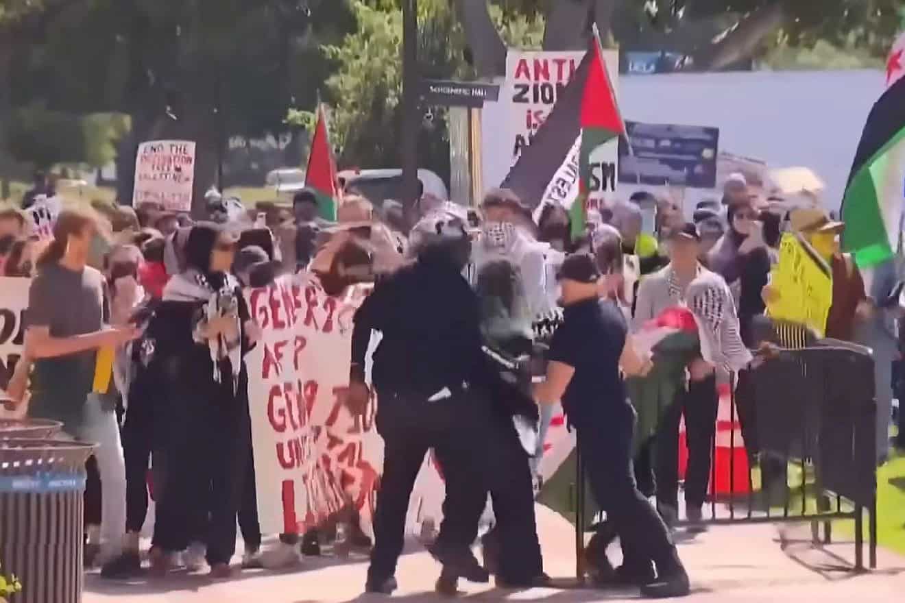 Police struggle to hold back anti-Israel protesters on UCLA's campus. Source: YouTube.