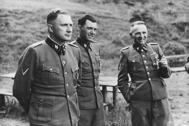 From left: German Nazi officers Richard Baer, Josef Mengele and Rudolf Höss on the grounds of the SS retreat outside of the Auschwitz concentration camp in Poland in 1944. Credit: United States Holocaust Memorial Museum via Wikimedia Commons.