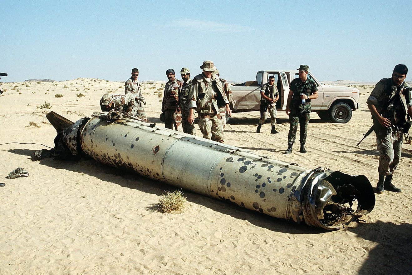 Military personnel examine a Scud missile shot down in the desert by an MIM-104 Patriot tactical air-defense system during “Operation Desert Storm,” May 26, 1992. Credit: U.S. Department of Defense via Wikimedia Commons.