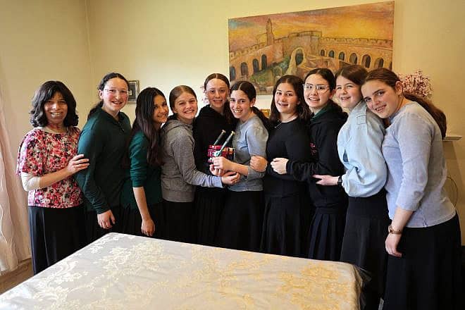 The Torah Prep robotics team, from left: Adviser Bella Bloom with students Basya Miller, Tzivi Glickfield, Rachelli Goldenhersh, Tzofia Bloom, Chaya Kass, Chana Sasportas, Nili Schuss, Malka Rosner and Esti Botuck. Photo by Bil Motchan,