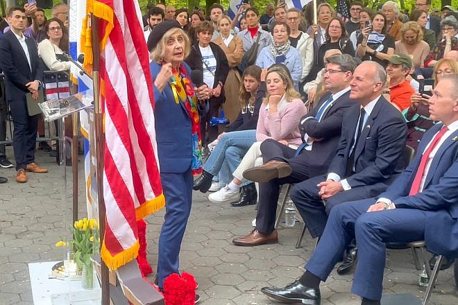 Tova Friedman, 86, Holocaust survivor and star of TikTok, speaks at a Yom Hashoah event in Manhattan as (seated from far right) Israeli ambassador to the United Nations Gilad Erdan, Israeli-American Council CEO Elan Carr and Israeli Consul General to New York Ofir Akunis look on, May 6, 2024. Photo by Mike Wagenheim.