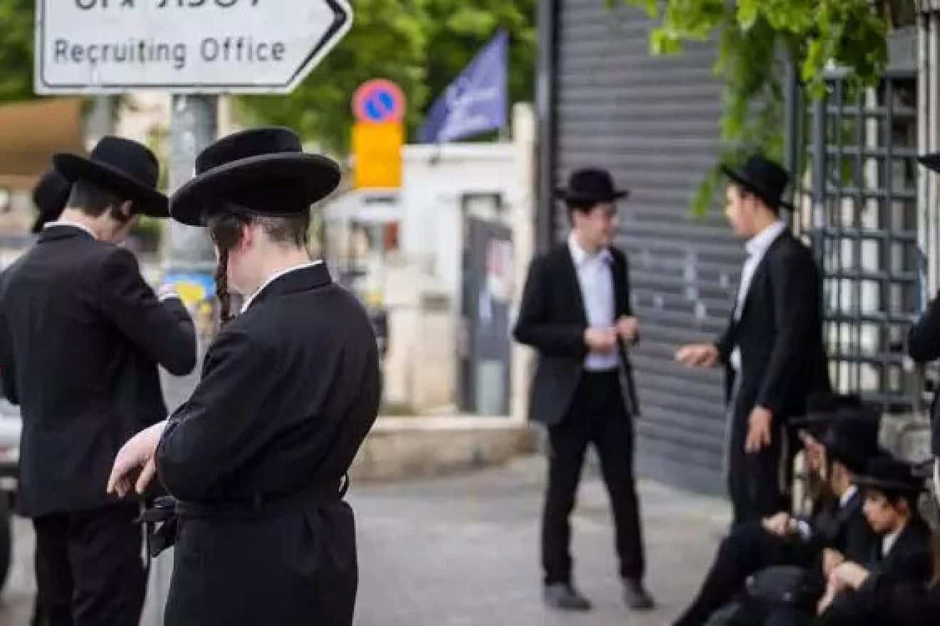 Ultra-Orthodox youngsters protesting outside an IDF recruitment center. Photo by Oren Ben Hakoon.