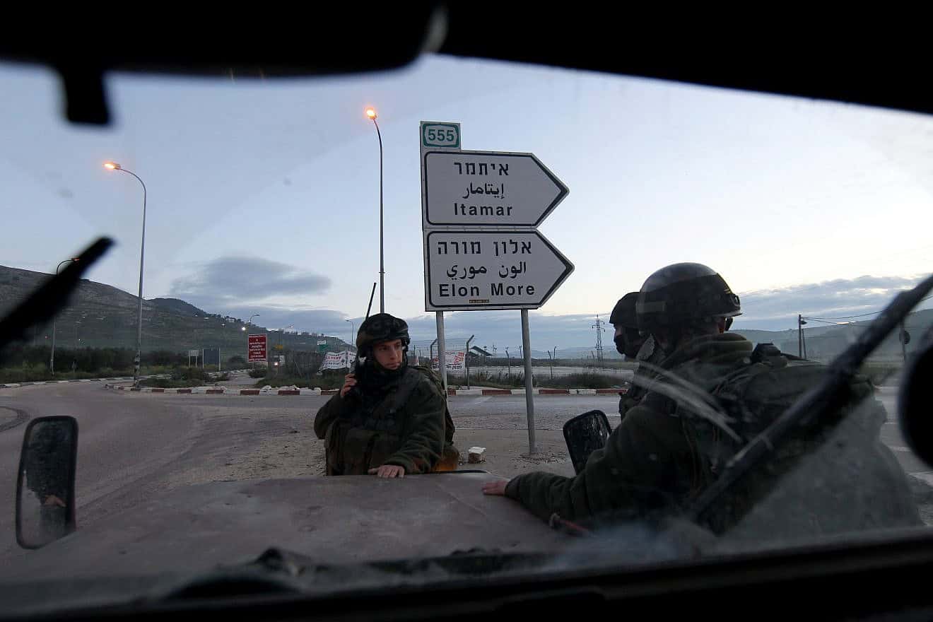 Israeli soldiers block a road near Huwara, south of the Samaria city of Nablus (Shechem), March 12, 2011. Photo by Nati Shohat/Flash90.