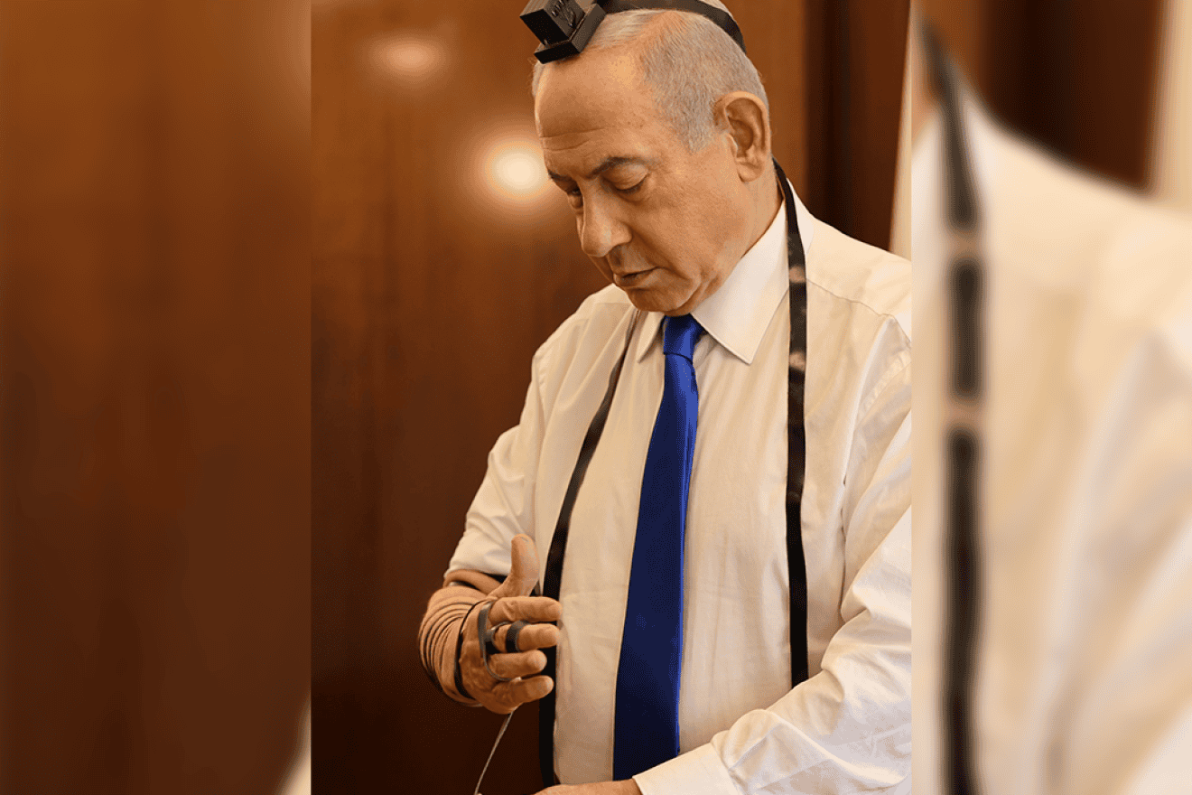 Israeli Prime Minister Benjamin Netanyahu dons tefillin (phylacteries), May 12, 2024. Credit: Prime Minister's Office.