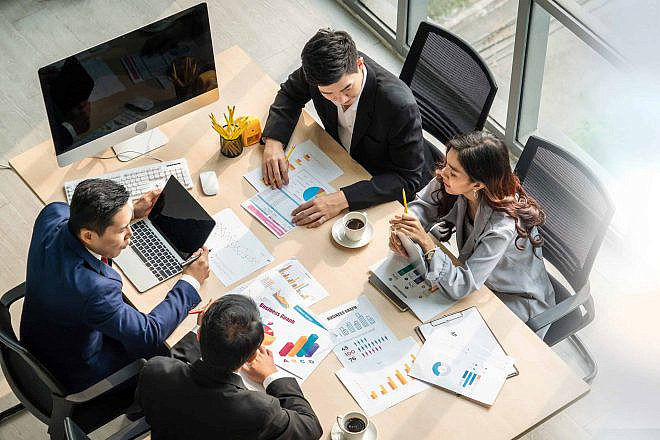An illustrative image of office workers. Credit: Summit Art Creations/Shutterstock