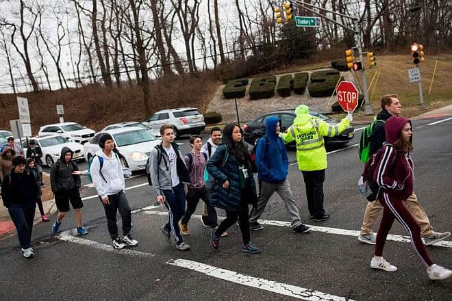 Students head home after classes at East Brunswick High School in East Brunswick, N.J., Feb. 22, 2018. Photo by Dominick Reuter/AFP via Getty Images.