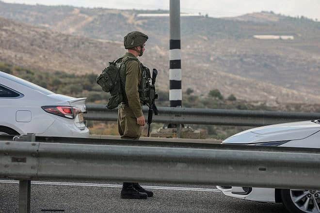 Israel Defense Forces troops at the scene of a car-ramming attack at the Maccabim Crossing near Modiin in central Israel, Nov. 2, 2022. Photo by Flash90.