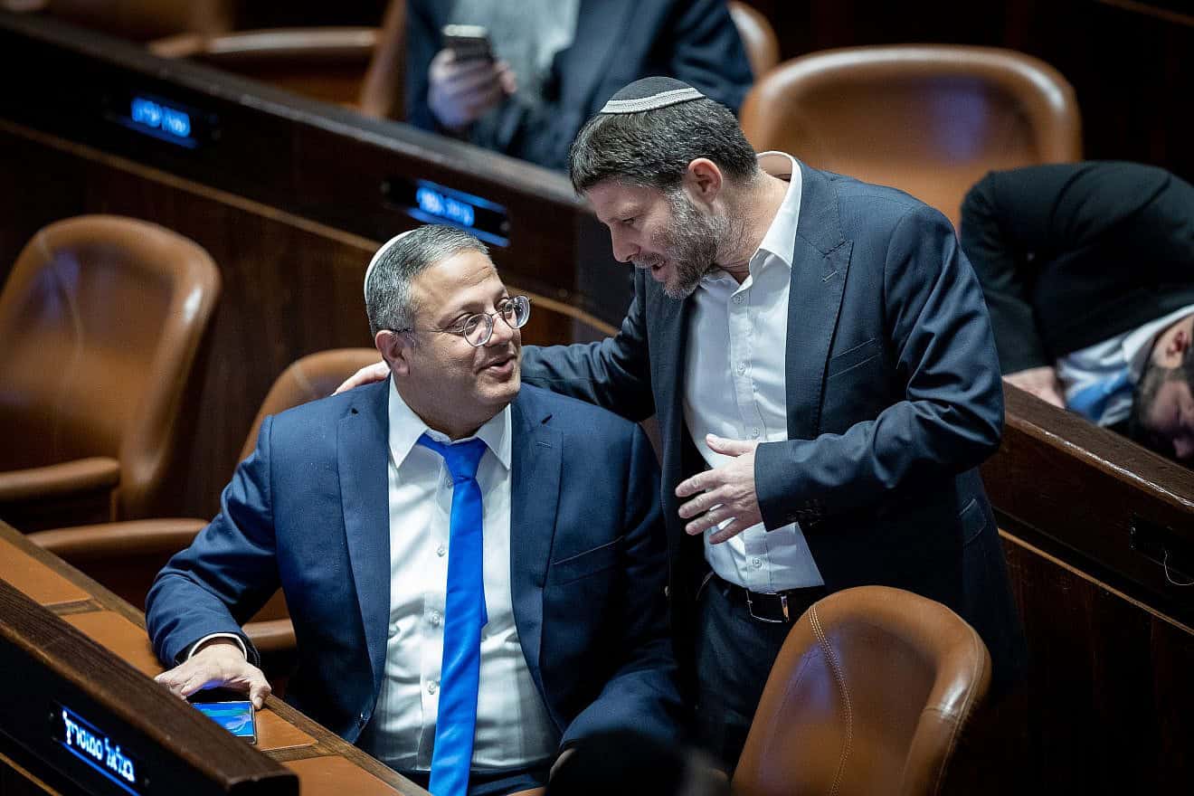 Then-MKs Itamar Ben-Gvir (left) and Bezalel Smotrich attend a plenum session at the Knesset in Jerusalem on forming a government, on Dec. 29, 2022. Photo by Yonatan Sindel/Flash90.