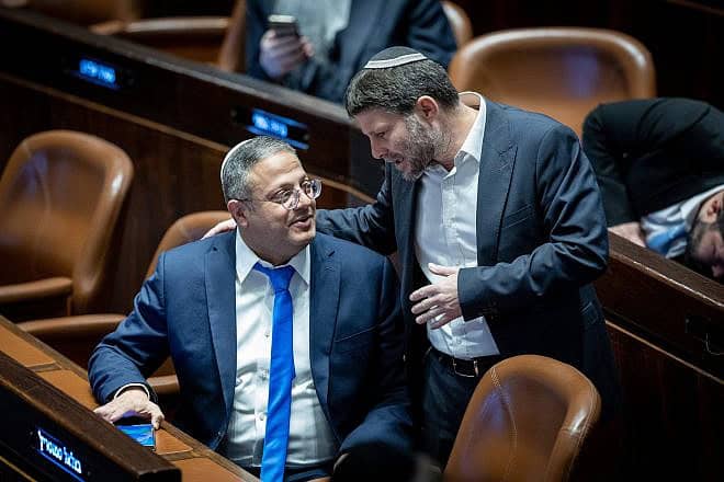 Then-MKs Itamar Ben-Gvir (left) and Bezalel Smotrich attend a plenum session at the Knesset in Jerusalem on forming a government, on Dec. 29, 2022. Photo by Yonatan Sindel/Flash90.