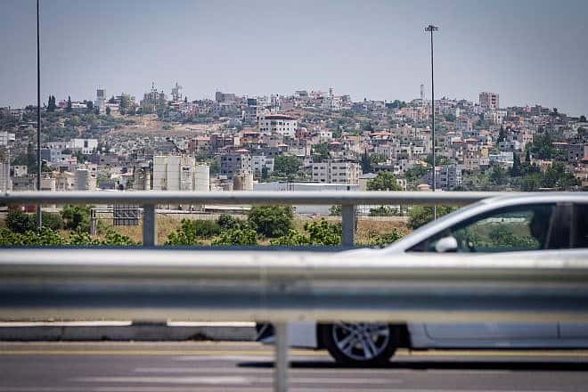 The Israeli town of Bat Hefer backdropped by the Palestinian city of Tulkarem, situated on the western edge of northern Samaria, May 29, 2024. Photo by Avshalom Sassoni/Flash90.